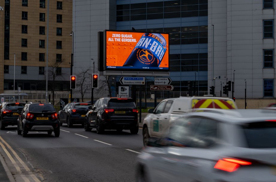 UK billboard advertising on a busy roadside